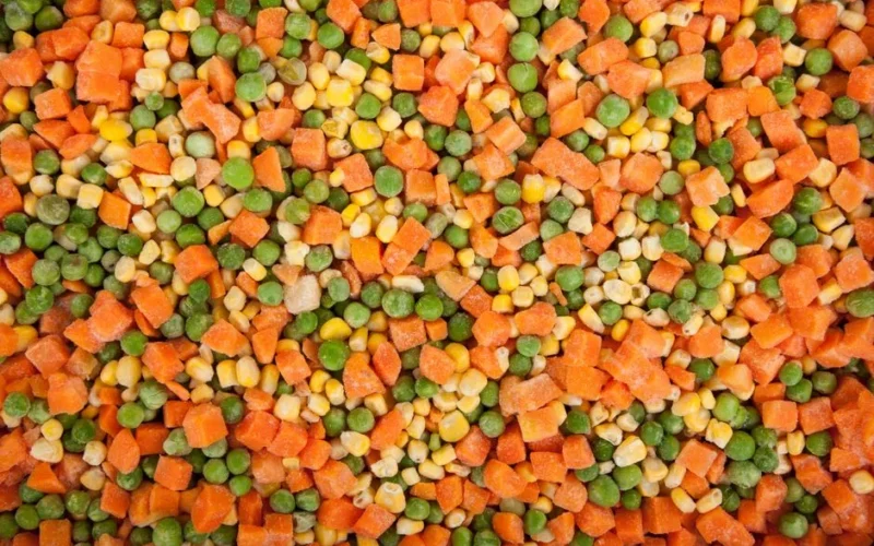 A vibrant mix of frozen carrots, peas, and corn showcasing healthy eating options.