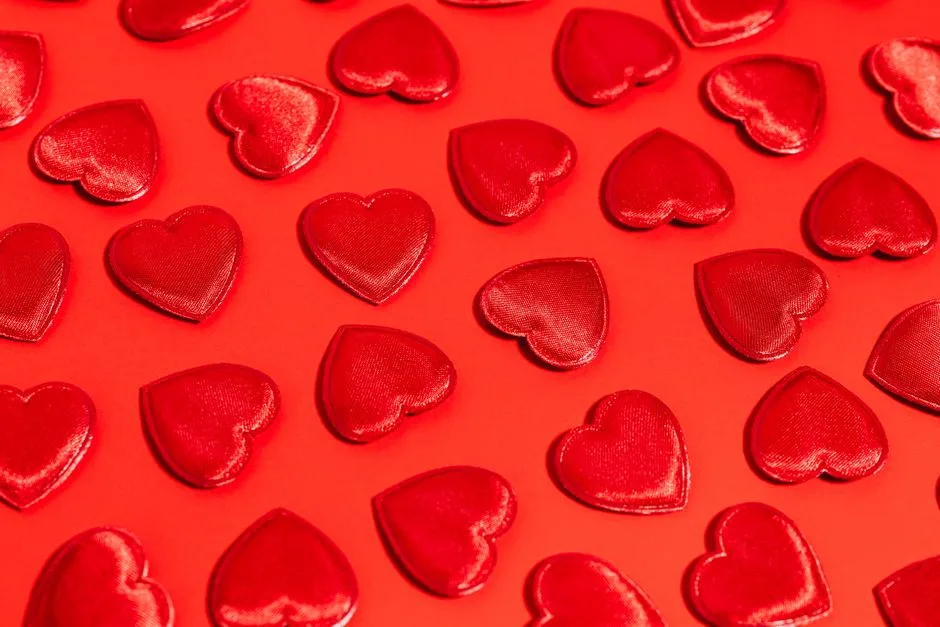 Festive red hearts on a bold red background perfect for Valentine's Day themes.
