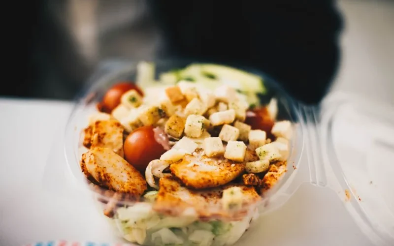 Delicious chicken salad with fresh greens and croutons, perfect for a healthy meal.